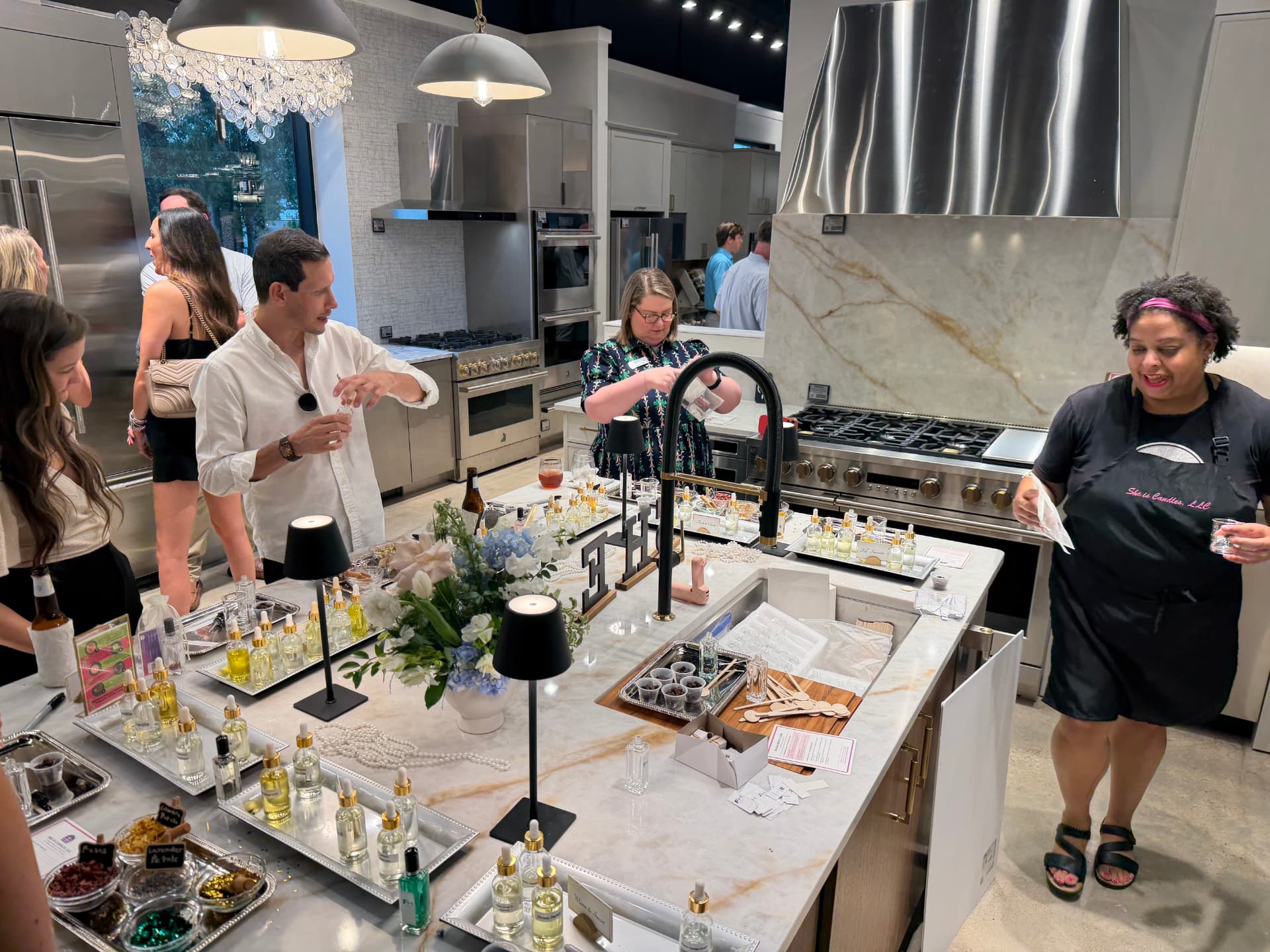 Corporate guests making custom perfume at the Ferguson Home demonstration kitchen